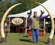 Christopher holding Maasai Tusk Holder 